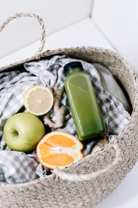 Glass jars of detox drinks with lemon, mint, and berries β for womenβs fat loss and cleansing