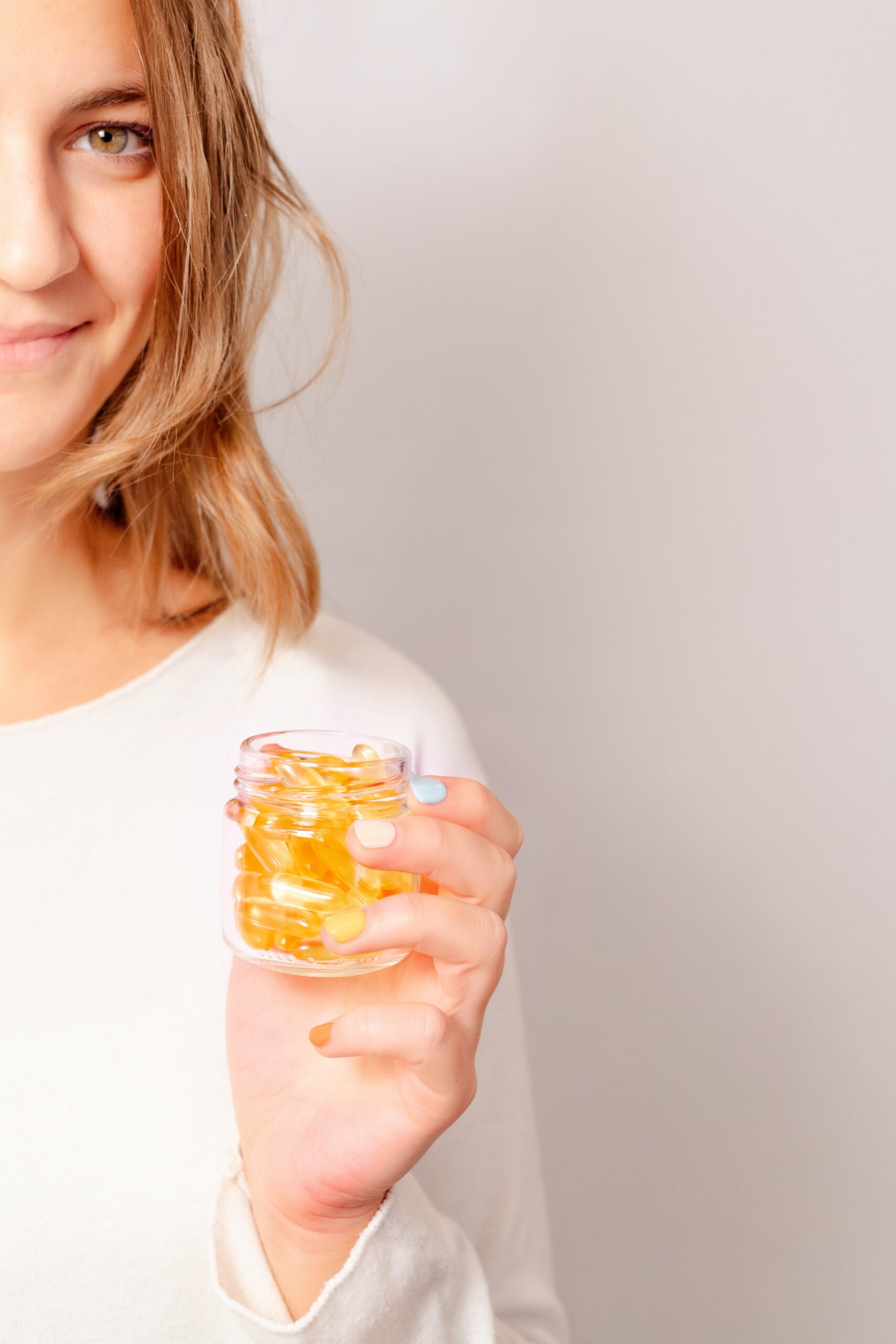 Glass jars of detox drinks with lemon, mint, and berries â natural cleanse for women